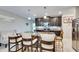 Kitchen boasts granite countertops and dark cabinetry at 16909 April Plush Dr, Wimauma, FL 33598