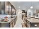 Open concept kitchen with granite counters and stainless steel appliances at 16909 April Plush Dr, Wimauma, FL 33598