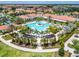 Expansive pool area with surrounding tropical landscaping at 16909 April Plush Dr, Wimauma, FL 33598