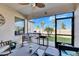 Relaxing screened patio with outdoor furniture at 16909 April Plush Dr, Wimauma, FL 33598