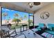 Screened patio with comfy seating and backyard view at 16909 April Plush Dr, Wimauma, FL 33598
