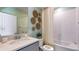 Simple bathroom with a bathtub, vanity, and a touch of coastal decor at 17932 Tavernside Trl, Lakewood Ranch, FL 34211