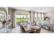 Bright dining area with patio access and hardwood floors at 17932 Tavernside Trl, Lakewood Ranch, FL 34211