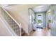 Elegant entryway with stairs, light flooring, and a view to the backyard at 17932 Tavernside Trl, Lakewood Ranch, FL 34211