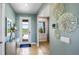 Bright entryway with tiled floors and view of backyard at 17932 Tavernside Trl, Lakewood Ranch, FL 34211