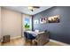 Bright home office features wood-look floors, a desk, and a view of the backyard at 17932 Tavernside Trl, Lakewood Ranch, FL 34211
