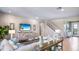 Living room with sectional sofa and views to entryway and stairs at 17932 Tavernside Trl, Lakewood Ranch, FL 34211
