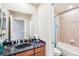 Bathroom with granite vanity and shower/tub combo at 1919 Blue River Rd, Holiday, FL 34691