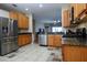 Bright kitchen, stainless steel appliances and wood cabinets at 19248 Barred Owl Ct, Land O Lakes, FL 34638