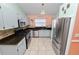 Bright kitchen with stainless steel appliances and granite counters at 2115 Cattleman Dr, Brandon, FL 33511