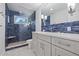 Modern bathroom with blue tile shower and vanity at 220 14Th N Ave, St Petersburg, FL 33701