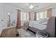 Bright bedroom with hardwood floors, large windows, and neutral decor at 220 14Th N Ave, St Petersburg, FL 33701