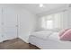 Bright bedroom with white bedding and wood floors at 220 14Th N Ave, St Petersburg, FL 33701