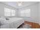Bright bedroom with hardwood floors, a plush bed, and window blinds at 220 14Th N Ave, St Petersburg, FL 33701