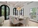 Bright dining room with large arched windows and a white table at 220 14Th N Ave, St Petersburg, FL 33701