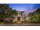 Spanish style home with palm trees and a landscaped yard at 220 14Th N Ave, St Petersburg, FL 33701