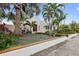 Front yard of Spanish home with palm trees at 220 14Th N Ave, St Petersburg, FL 33701