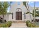 Spanish style home with ornate wooden door at 220 14Th N Ave, St Petersburg, FL 33701