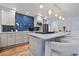 Modern kitchen features a white and blue chevron backsplash and island at 220 14Th N Ave, St Petersburg, FL 33701