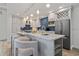 Modern kitchen with white cabinets, blue chevron backsplash, and island at 220 14Th N Ave, St Petersburg, FL 33701