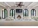 Spacious living room with hardwood floors, fireplace, and arched doors at 220 14Th N Ave, St Petersburg, FL 33701