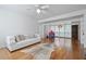 Spacious living area with hardwood floors, white sofa, and a cowhide rug at 220 14Th N Ave, St Petersburg, FL 33701