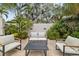 Relaxing patio furniture in a lush garden setting at 220 14Th N Ave, St Petersburg, FL 33701