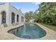 Inviting kidney-shaped pool with a tiled surround in the backyard at 220 14Th N Ave, St Petersburg, FL 33701