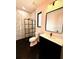 Modern bathroom with marble shower and dark hexagon tile at 225 Tournament Rd, Rotonda West, FL 33947