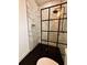 Spa-like bathroom with marble shower and dark floor tile at 225 Tournament Rd, Rotonda West, FL 33947