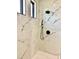 Large walk-in shower with marble tile and rainfall shower head at 225 Tournament Rd, Rotonda West, FL 33947