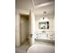 Modern bathroom with white vanity, toilet, and bathtub at 225 Tournament Rd, Rotonda West, FL 33947