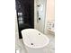 Elegant bathroom with soaking tub, walk-in shower, and modern fixtures at 225 Tournament Rd, Rotonda West, FL 33947