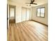 Spacious bedroom with wood-look floors and ceiling fan at 225 Tournament Rd, Rotonda West, FL 33947