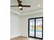 Bright bedroom with pool view and sliding glass doors at 225 Tournament Rd, Rotonda West, FL 33947