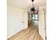 Bright entryway with chandelier and view into living area at 225 Tournament Rd, Rotonda West, FL 33947