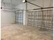 Spacious two-car garage with high ceilings and ample storage space at 225 Tournament Rd, Rotonda West, FL 33947