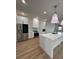 Modern kitchen with stainless steel appliances and white cabinets at 225 Tournament Rd, Rotonda West, FL 33947