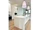 Modern kitchen featuring a large island and stainless steel appliances at 225 Tournament Rd, Rotonda West, FL 33947