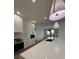 Open concept kitchen with white cabinets and quartz countertops at 225 Tournament Rd, Rotonda West, FL 33947