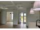 Bright and airy living area with access to the outdoors at 225 Tournament Rd, Rotonda West, FL 33947