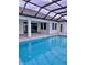 Stunning pool and patio with covered lanai at 225 Tournament Rd, Rotonda West, FL 33947