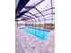 Relaxing screened pool with paver deck at 225 Tournament Rd, Rotonda West, FL 33947