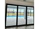 Stunning pool view from interior sliding glass doors at 225 Tournament Rd, Rotonda West, FL 33947