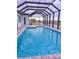 Relaxing screened pool with open water view at 225 Tournament Rd, Rotonda West, FL 33947