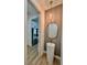 Stylish powder room with a pedestal sink and contemporary fixtures at 225 Tournament Rd, Rotonda West, FL 33947