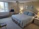 Spacious bedroom with king-size bed and water view at 255 Dolphin Pt # 511, Clearwater Beach, FL 33767