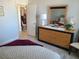 Bedroom with dresser and view into dining area at 255 Dolphin Pt # 511, Clearwater Beach, FL 33767