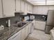 Updated kitchen with granite countertops at 255 Dolphin Pt # 511, Clearwater Beach, FL 33767