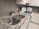 Granite countertop kitchen with stainless steel sink at 255 Dolphin Pt # 511, Clearwater Beach, FL 33767